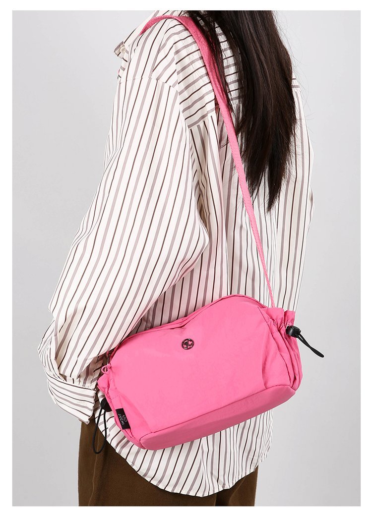 Women's nylon crossbody bag interior view - organized compartments