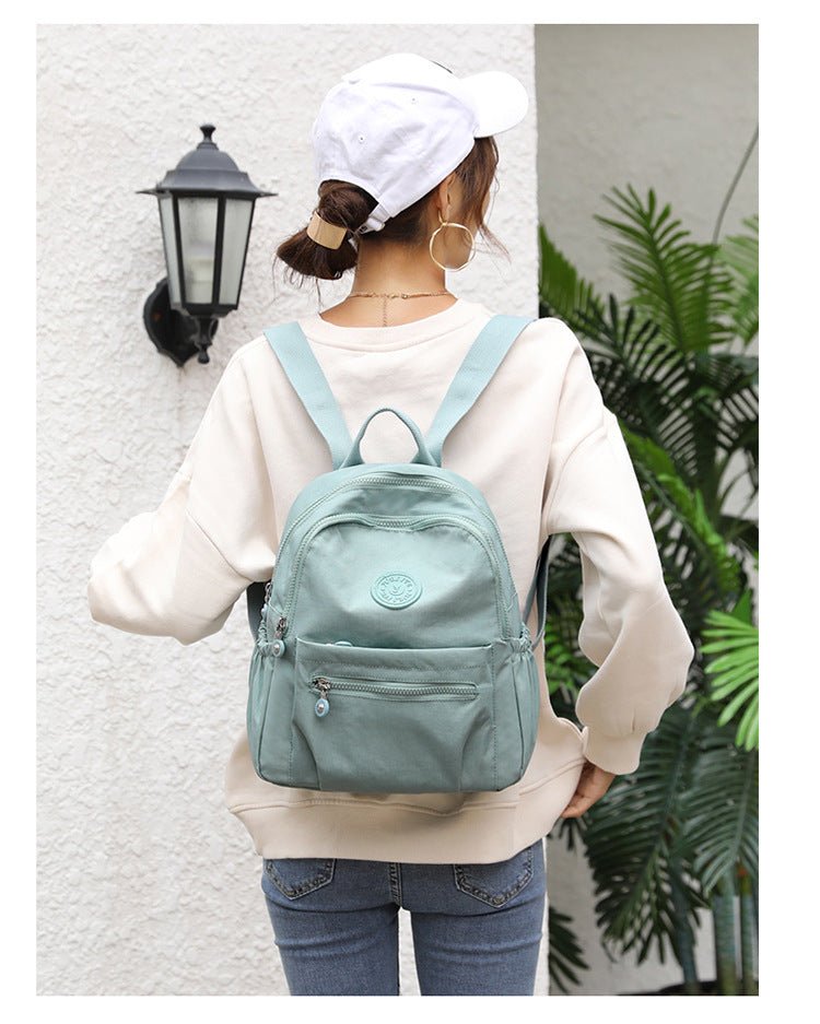 Women's nylon oxford backpack side view - spacious school bag