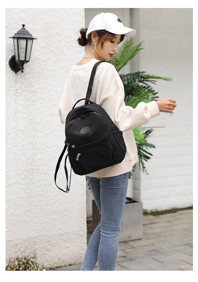 Women's nylon oxford backpack interior view - multiple compartments